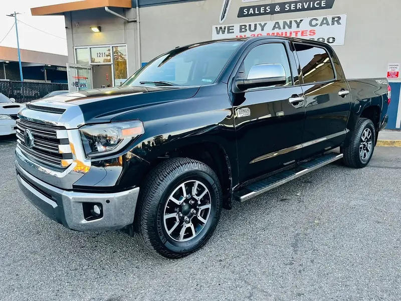 2019 Toyota Tundra photographed on the dealer lot with a phone